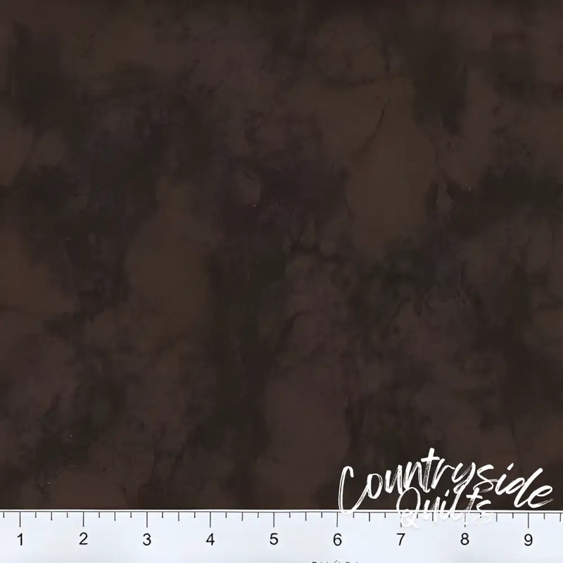 Dark brown mottled fabric with a ruler, showcasing 108’’ Marble - Chocolate design