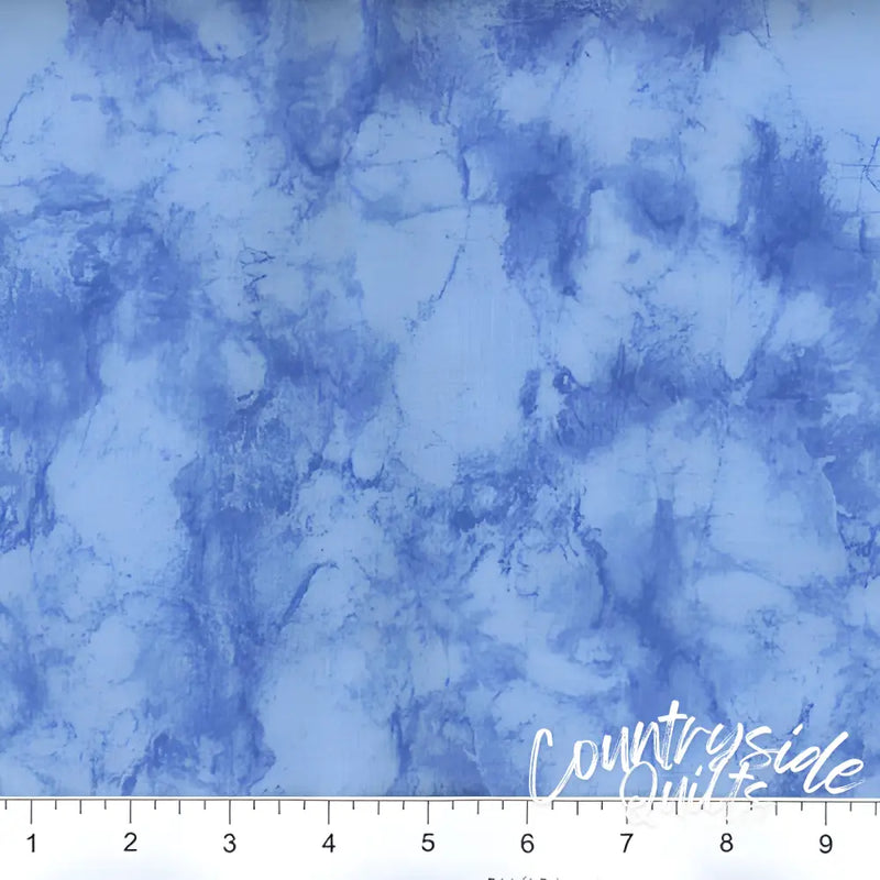 Blue marbled fabric featuring watercolor patterns in 108’’ Marble - Light Blue design