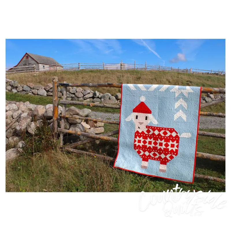 Red and white patterned sheep quilt with Santa hat from Art East Quilting Ewe Quilt Pattern