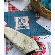 Hand-embroidered floral fabric from Aunt Martha’s #4022 Proud To Be An American quilting design