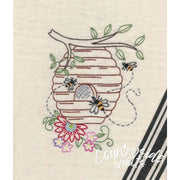 Embroidered beehive with bees and flowers from Aunt Martha’s Buzzing Bees pattern