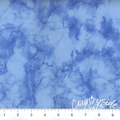 Blue marbled fabric featuring watercolor patterns in 108’’ Marble - Light Blue design