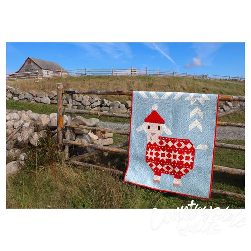 Red and white patterned sheep quilt with Santa hat from Art East Quilting Ewe Quilt Pattern
