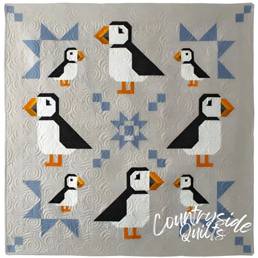 Puffin Star Quilt pattern with eight puffins and blue geometric accents by Art East Quilting