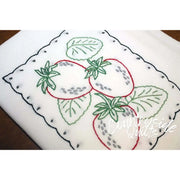 Embroidered strawberry design on Aunt Martha’s Fruit Tea Towels with scalloped border