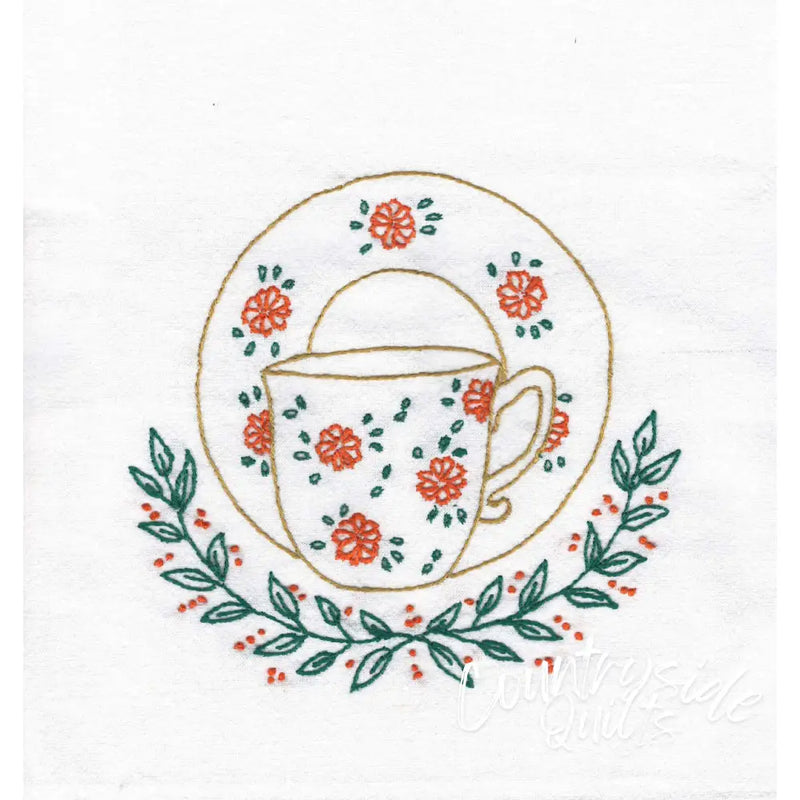Floral Teacups by Aunt Martha’s featuring coral flowers and green leaves embroidery