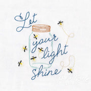 Mason jar with Let your light shine design by Aunt Martha’s features blue fireflies embroidery