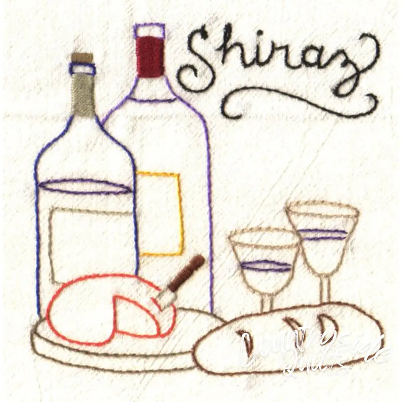 Embroidered wine and cheese still life on Aunt Martha’s® Wine Country countryside quilt